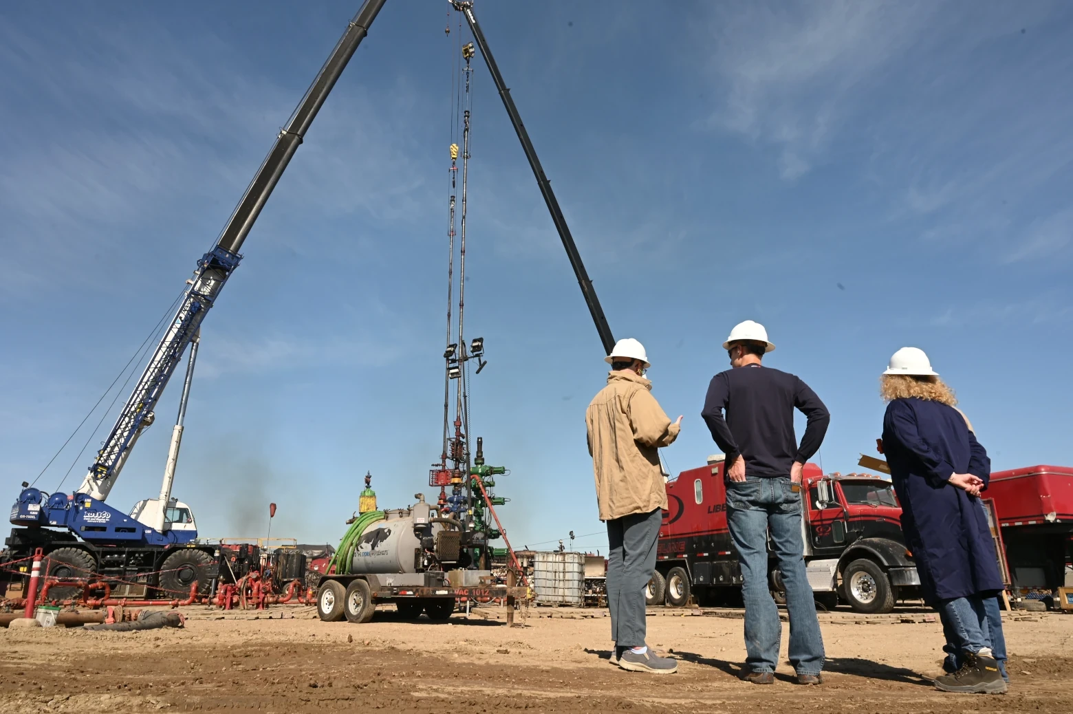 Image of a Skyward employees monitoring construction using a crane.